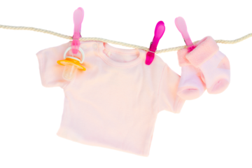baby girl clothes hanging on rope
