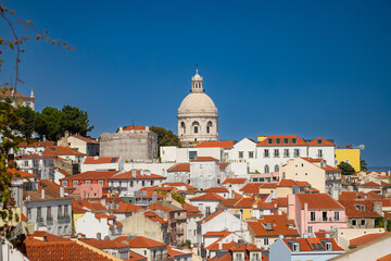 Fototapeta premium Beautiful view of Lisbon city. Colorful houses and view of the city. Skyline of Alfama district, the oldest neighborhood of Lisbon in Portugal