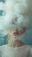 Fototapeta premium Enigmatic atmosphere created by white smoke covering the face of a young blonde woman in a close-up portrait