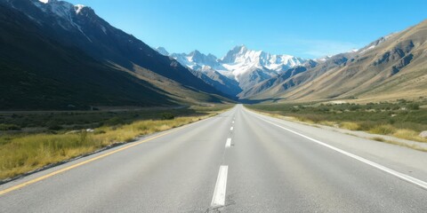 Naklejka premium Empty highway running through stunning mountain landscape with blue sky, landscape, scenic