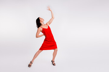 Full length photo of gorgeous charming lady wear seductive red dress enjoy ballroom dance copy space isolated white color background