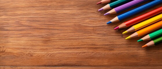 Obraz premium A group of colored pencils on a wooden surface