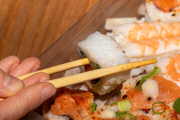 Sushi Roll with White Rice and Salmon in Plastic Container