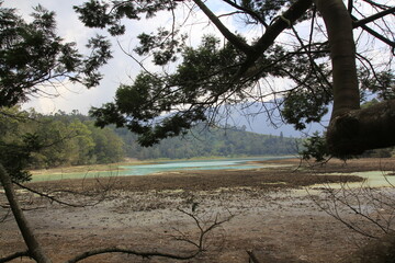 Telaga Warna, tourist destination lake in Dieng, where the water often recedes during the long dry season.