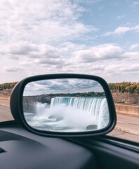 Fototapeta premium Reflection of Waterfall in Side Mirror of Car