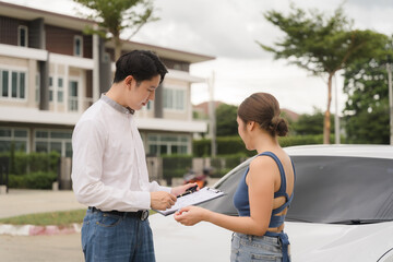 Fototapeta premium Home Purchase Consultation: Happy couple reviewing documents with real estate agent outside new house 
