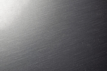 This is a close-up of brushed metal with a smooth, shiny finish