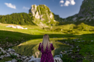 Blonde woman in the Swiss Alps, Gurnigel Pass.