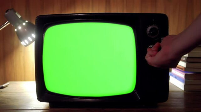 Hand Switching On Green-Screen Television - Close Up - You Can Replace Green Screen with the Footage or Picture You Want with 'Keying' Effect (Check Out Tutorials) 