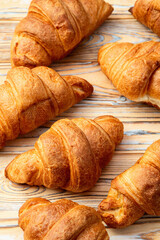 Group of sweet croissant . French morning breakfast . Top view