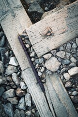 wooden beams bound with iron on stones