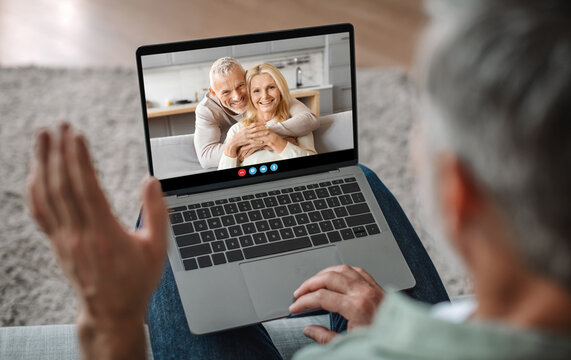 A person waves while communicating via video call, engaging with a happy couple who are smiling at the screen. The setting is a cozy indoor environment, embodying warmth and connection. - Powered by Adobe