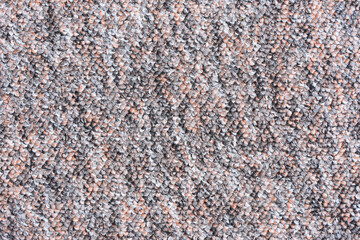 Carpet texture. Abstract beige and brown backdrop with a closeup of clean canvas and carpet texture. Detailed fabric fibers and design. Soft cotton floor covering for home decor and decoration.