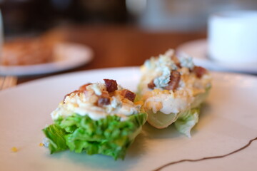 WEDGE SALAD smoked bacon, hard boiled egg. blue cheese. chic restaurant service of luxury hotel