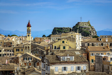 Obraz premium View towards the Old Fortress from the New Fortress over the rooftops of Corfu Old Town, also known as Kerkyra, Corfu, Greece