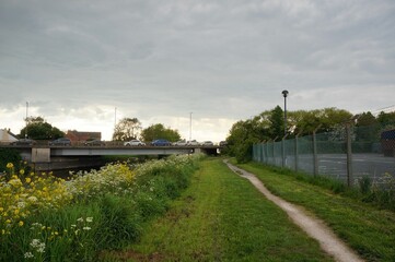 Footpath alongside the Forty-foot waterway leading under the Spalding road bridge in Boston Lincolnshire