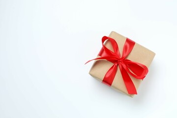 Beautiful gift box tied with bow on white background 