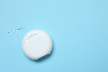 Dental floss on blue background