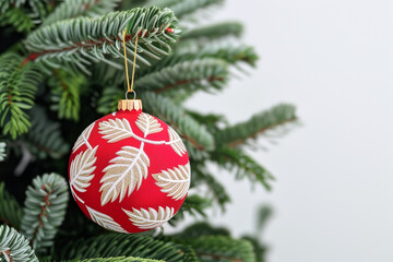 Beautiful Red and Gold Christmas Ornament Hanging on Tree