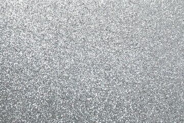 Silver glitter texture sparkling shiny wrapping paper background for Christmas holidays seasonal wallpaper decoration, greeting and wedding invitation design element