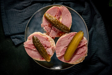 Tasty sandwich with brawn and pickled cucumber.