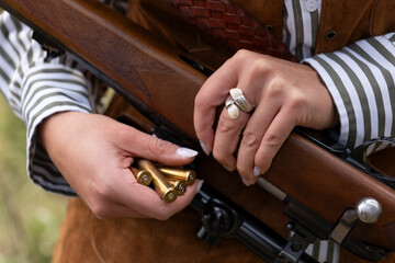 Photographs of a Spanish female hunter in her traditional uniform: Images should NOT be used for anti-hunting campaigns.