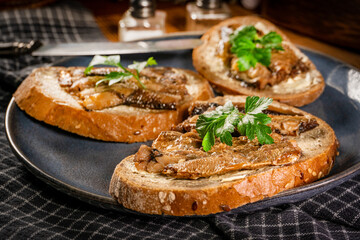 Slices of multigrain bread with sprats.