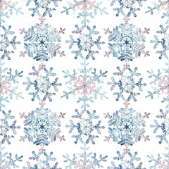 Seamless winter pattern. Granulation watercolour snowflakes on a white background. Hand drawn illustration. Frost crystals drawn by hand. For fabric, sketchbook, wallpaper, wrapping paper, invitation