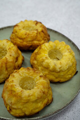 Closeup view of fish and pumpkin muffins in a dish on the white table	