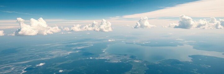 A breathtaking aerial view of the world from above, showcasing a vast expanse of land, sea, and sky with fluffy clouds floating peacefully, nature, view