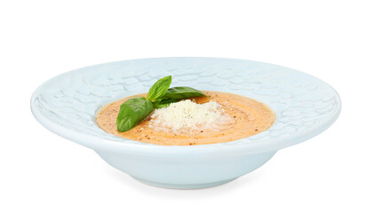Delicious sweet potato soup with basil and parmesan cheese isolated on white