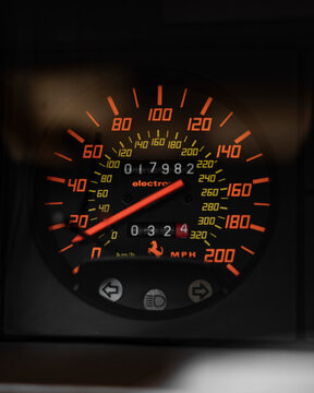 Ferrari Testarossa illuminated speedometer detail, Classic supercar dashboard gauge in miles per hour