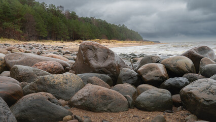 Waves and stones at the beach. Beautiful sea landscape..