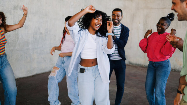 Dance party, Group of young people have fun celebrating at holiday festival together. Happy diverse friends, gen z trend concept