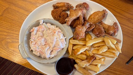 Fried Chicken Wings, French Fries, Coleslaw, and Sauce