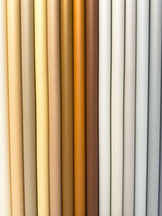Fototapeta premium A row of colorful paper tubes, each a different color