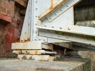 Metal elements of the old bridge connected together with rivets.