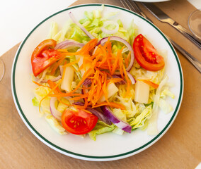 Tomato, carrot and other vegetable salad closeup