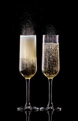 toasting with champagne glasses isolated on black background