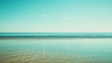 Obraz premium An endless ocean view under a clear sky paints a serene scene of tranquility and infinite possibilities, inviting quiet reflection.