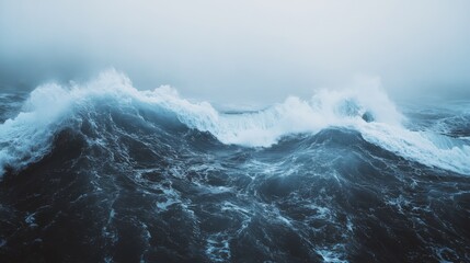 Towering waves crash dramatically against each other in a stormy sea, illustrating nature&rsquo;s raw power and turbulent beauty.