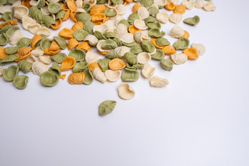 Raw pasta background close up. Different types of pasta and noodles on color background. Italian cuisine culinary concept. Collection of different raw pasta on cooking table