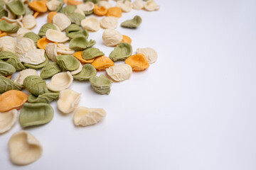 Raw pasta background close up. Different types of pasta and noodles on color background. Italian cuisine culinary concept. Collection of different raw pasta on cooking table