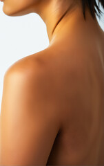 Back View of Woman's Shoulder and Upper Back, Emphasized by Low-Angle Perspective and Soft Lighting