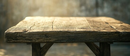 Rustic wooden table with a weathered finish set against a softly blurred background ideal for interior design and decor inspirations