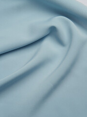 Beautiful folds of blue fabric..High-quality fabric texture.