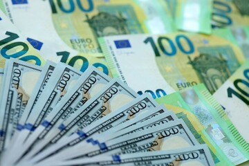 Big pile of Euro and USD banknotes. Many european and united states dollars