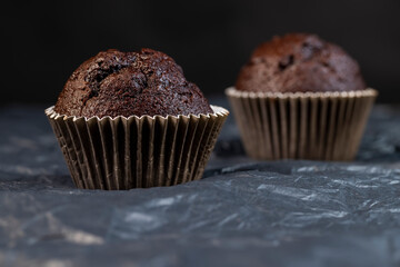 fresh and soft black chocolate cupcake on black paper