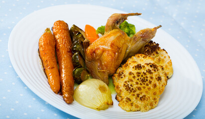 Delicious roasted whole quail served with assorted baked vegetables and honey-mustard sauce