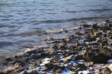Winter landscapes in Norway showcase serene snowy mountains, icy fjords, and peaceful coastal views. Capturing the beauty of snow-covered trees, quiet roads, and glowing sunsets creates a sense of cal